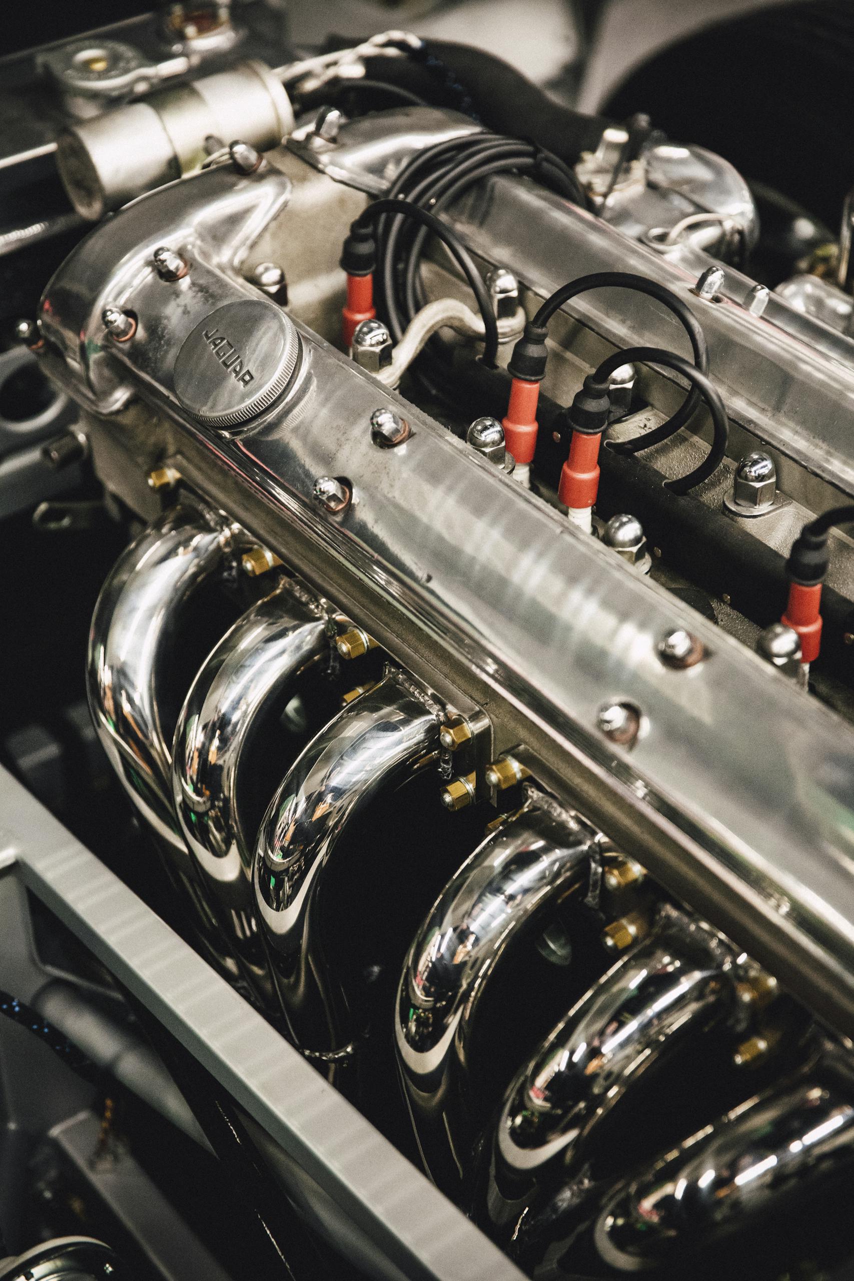 Detailed view of a polished chrome engine, showcasing luxury automotive design.